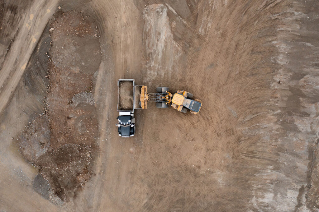 Dumptruck and crawler dozer