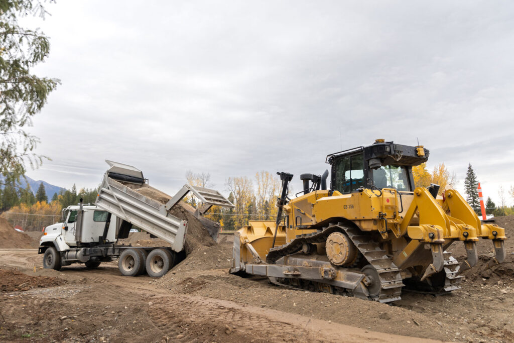 Dumptruck and crawler dozer